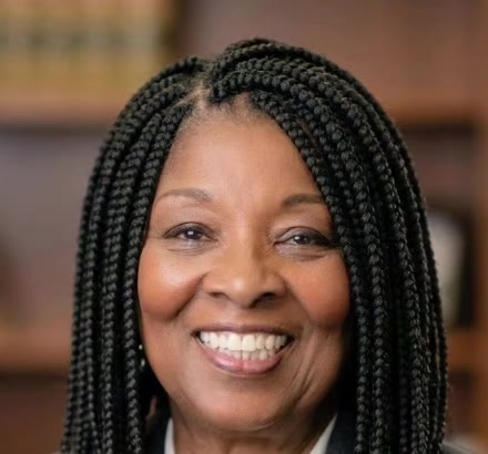 Jannette Thompson, notary public, smiling in a charcoal blazer